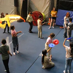 Photo of children experimenting with various circus skills
